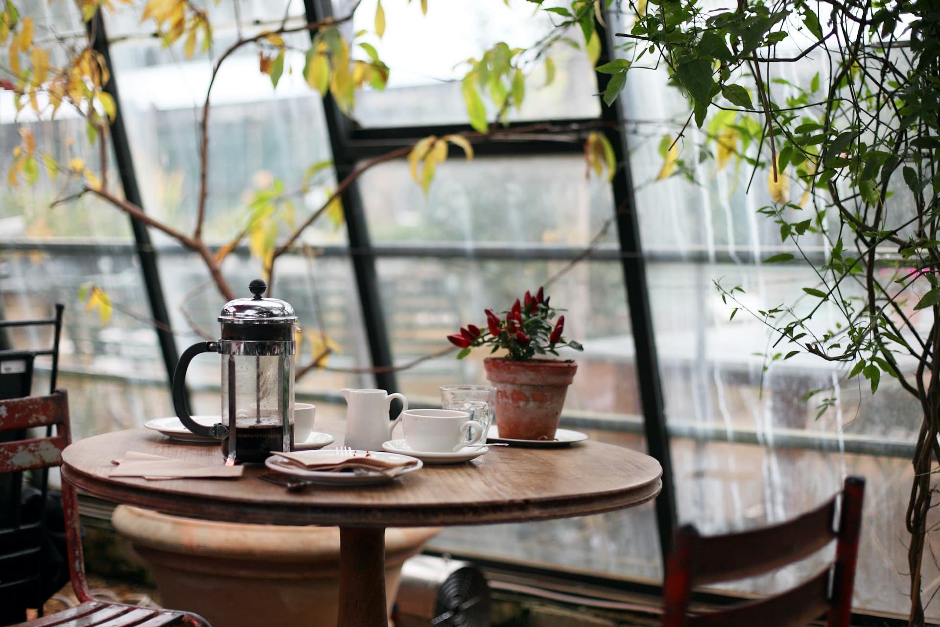 A table set for coffee and conversation by a bright window